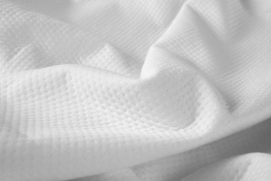 A close view of the mattress protector's fabric.